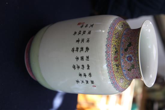 A pair of Chinese famille rose lantern shaped vases, height 29cm, wood stands